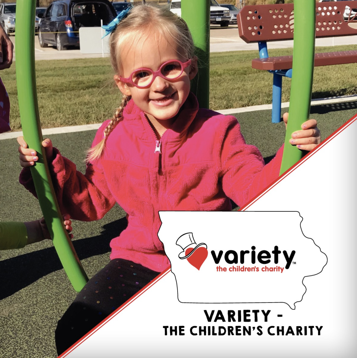 Girl in pink shirt playing on Variety inclusive playground 