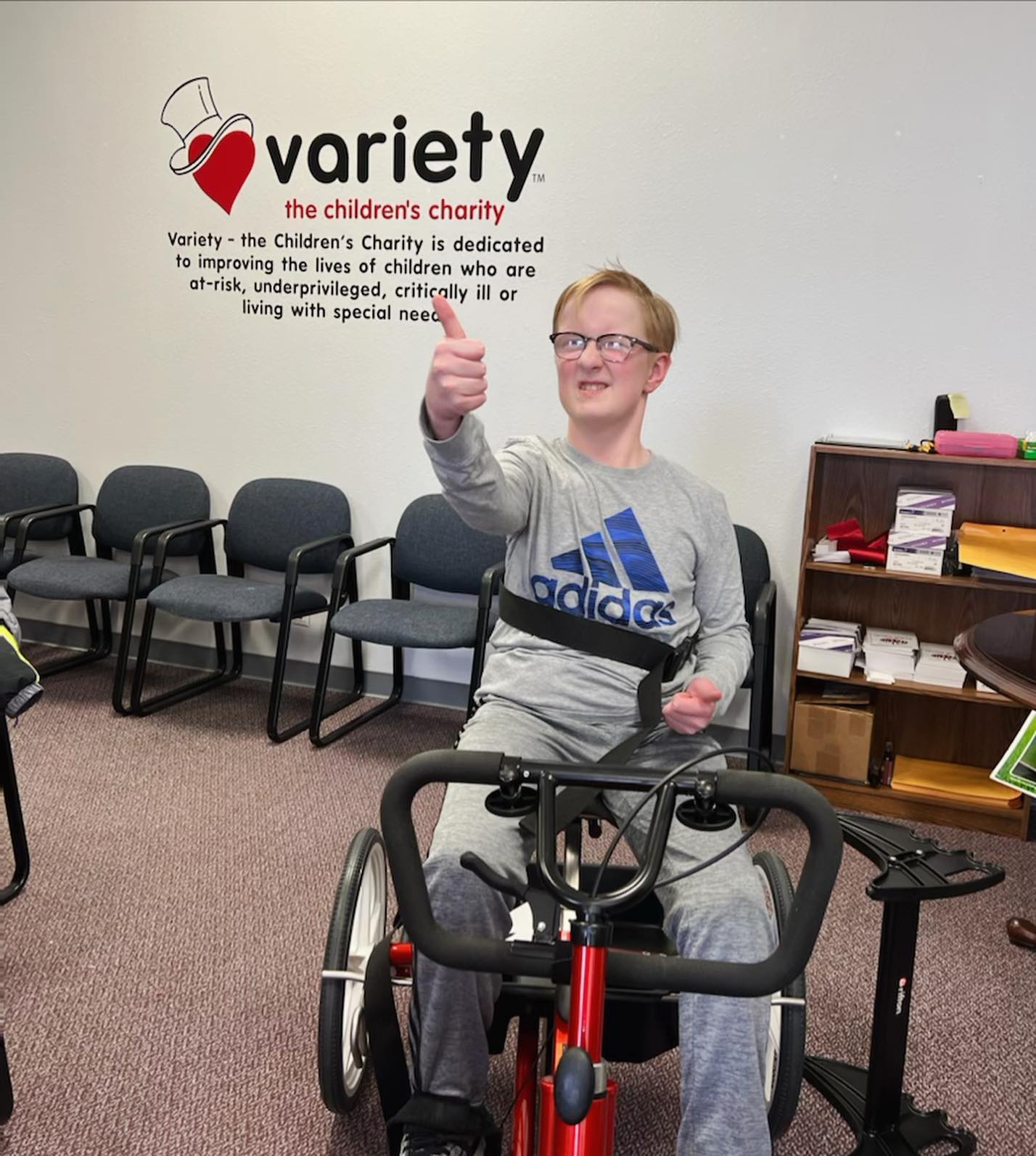 Child living with special needs on a specialized bike